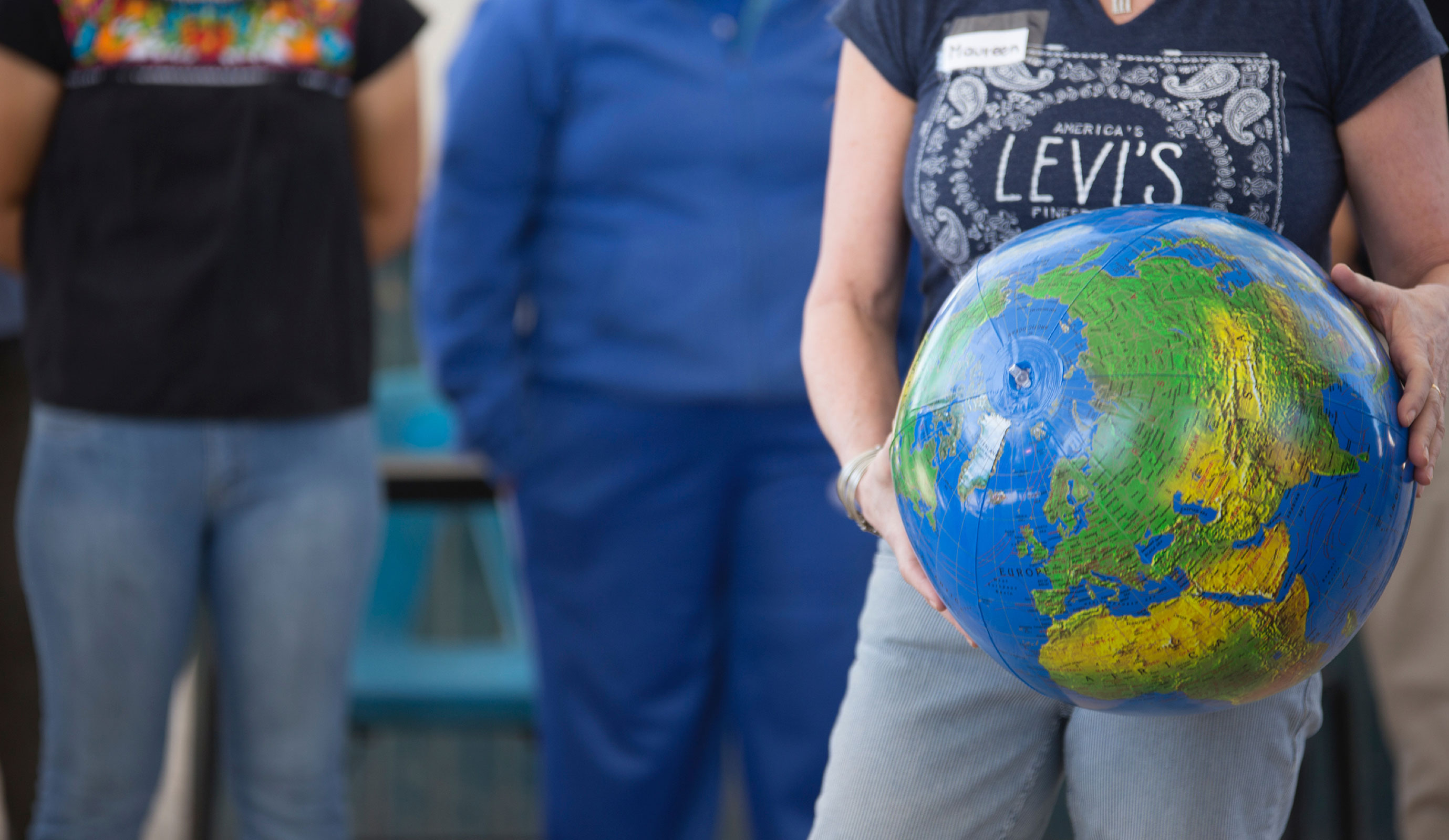 person holding a globe