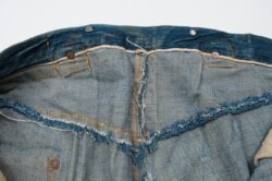 Interior waistband selvedge detail on the XX (1879) 501® jean depicting the back of copper rivets and stitching details.
