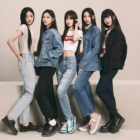 K-pop girl group NewJeans stands in front of a plain background wearing Levi's® products