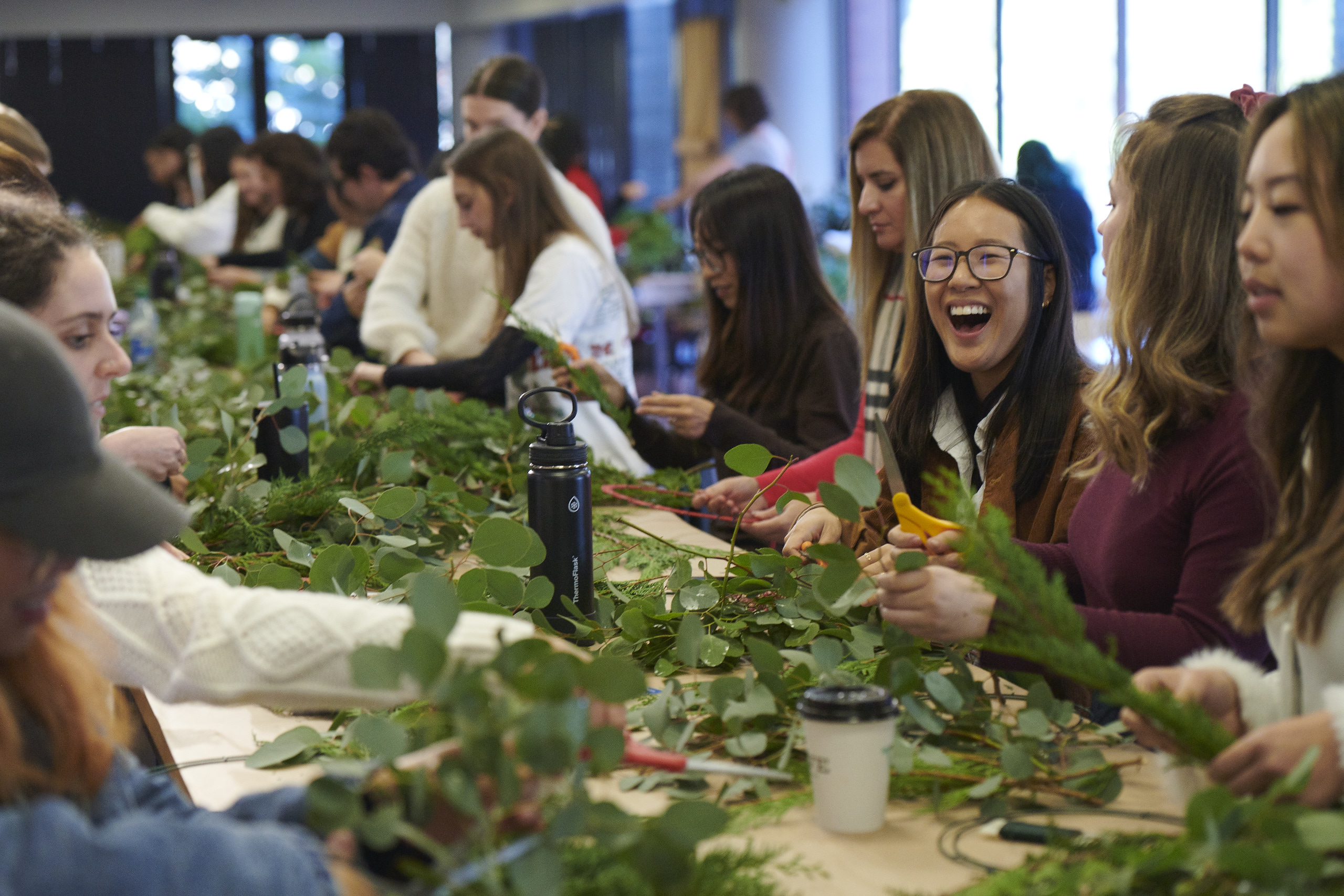 Sarah Mayhue at table making wreaths with other LS&Co. employees