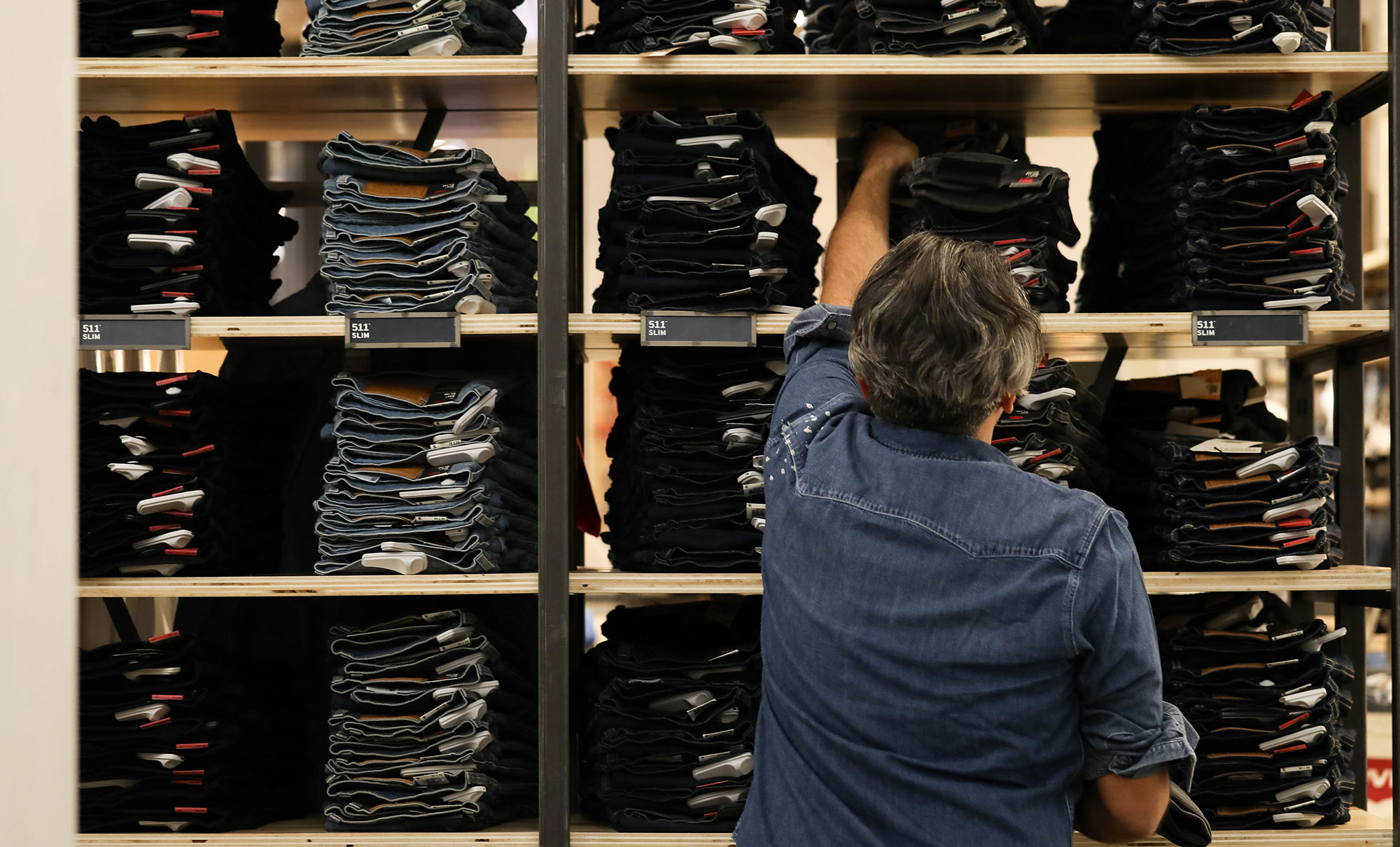 back of employee staffing a Levi's® store