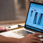 a laptop screen shows products on the Levi's® website