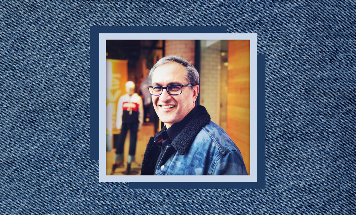 A close up headshot of LS&Co. Chief Financial & Growth Officer Harmit Singh sits on top of a textured denim background