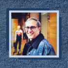 A close up headshot of LS&Co. Chief Financial & Growth Officer Harmit Singh sits on top of a textured denim background