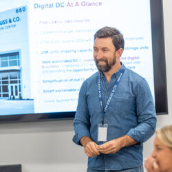 LS&Co. Vice President of Operations John Prendergast wearing a Levi's® chambray shirt gives a presentation