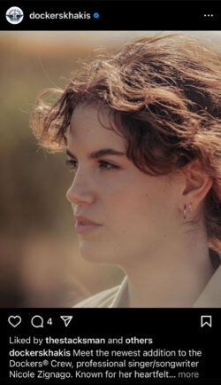 A screenshot of a Dockers® Instagram post. The photos is a close up of singer/songwriter Nicole Zignago, who has short wavy brown hair and is wearing a nose ring. Caption reads "Meet the newest addition to the Dockers® Crew, professional singer/songwriter Nicole Zignago. Known for her heartfelt lyrics and distinct melodies, her personal style is equal parts girly, boyish, and comfortable. This unique blend of authenticity and self-expression is what makes her the perfect addition to the family."