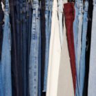 Various washes of Levi's® denim jeans hang next to each other