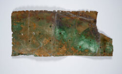 A rusty copper hull from a ship that once carried gold for Levi Strauss. 