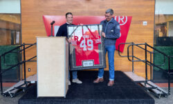 49ers President Al Guido presents LS&Co. CEO Chip Bergh with a custom "Bergh" 49ers jersey, framed and signed by this season's players.