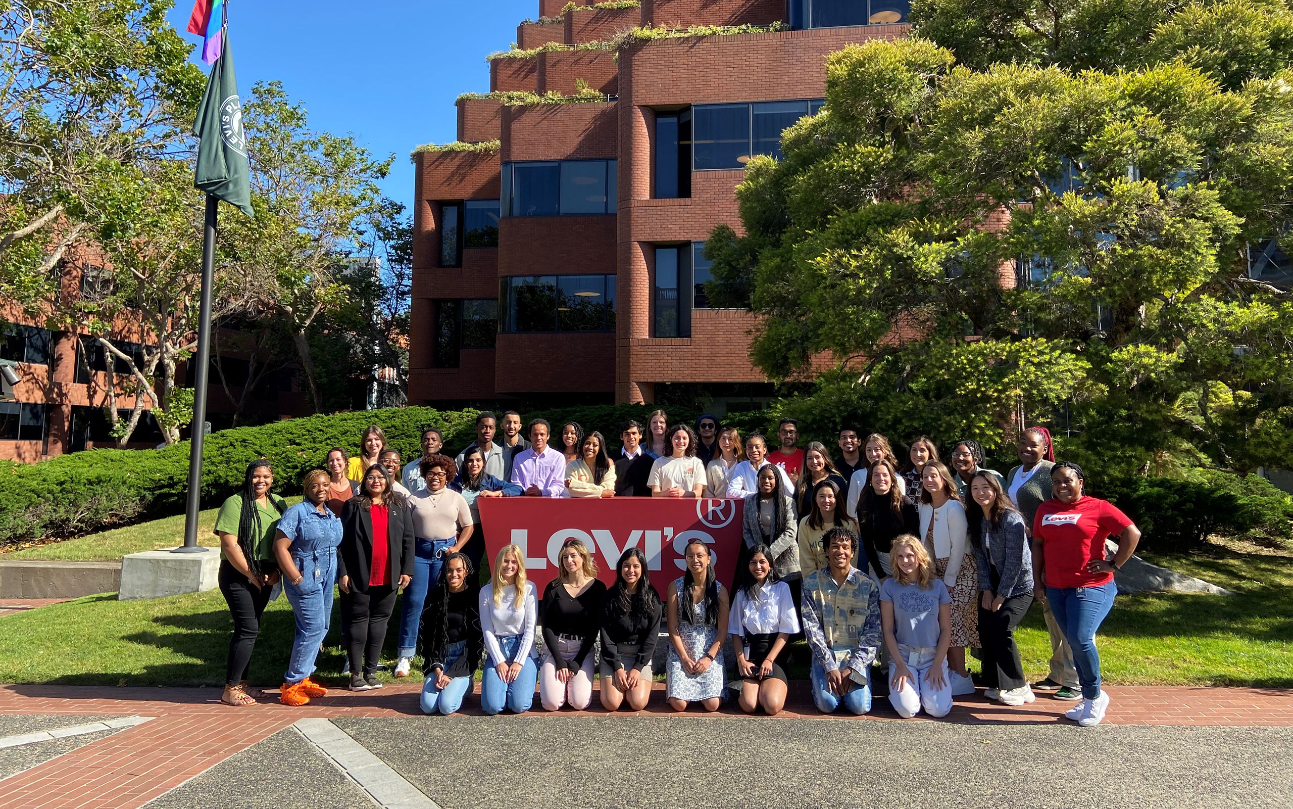 A large group of LS&Co. interns stand outside the LS&Co. headquarters office in San Francisco, CA.