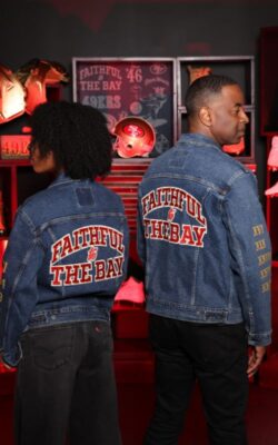A man and a woman wearing Levi's x 49ers Trucker jackets with text reading Faithful to the Bay