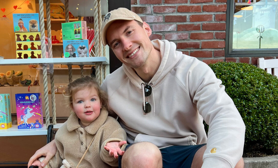 The new CEO of Beyond Yoga®, Justin Brandt, poses with his daughter.