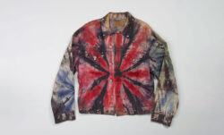 A tie-dye Levi's® Trucker jacket on a grey background.
