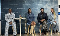 Four Project Onyx ERG members pose on stools against a Levi Strauss & Co. step and repeat background.