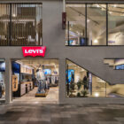 The exterior of the Levi's® store in Kyoto, Japan, featuring large windows and a Levi's® logo above an open doorway leading to mannequins.