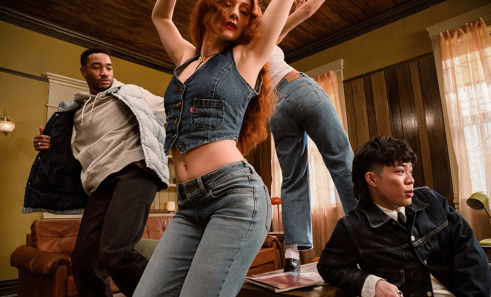 A still from the 2024 Live in Levi's® campaign video, "The Floor is Yours," featuring Ffur friends wearing Levi's® products in the middle of dancing in a living room.