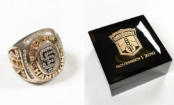 Left: an SF Giants World Series champion ring featuring the SF Giants logo. Right: a black ring box featuring the SF Giants logo and the text "November 1, 2010"