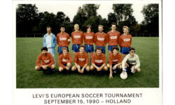 An LS&Co. soccer team wears matching orange Levi's® uniforms. The image is captioned "Levi's European Soccer Tournament September 15, 1990 - Holland"