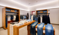 An assortment of Levi's® product in the corner of a Holt Renfrew department store