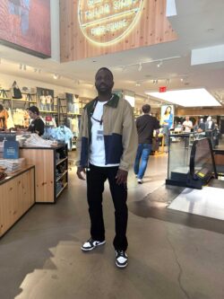 Levi's® stylist Arouna Doucoure stands inside the Levi's® Times Square store