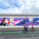 A photo of a mural on San Francisco's Embarcadero, featuring San Francisco maritime icons