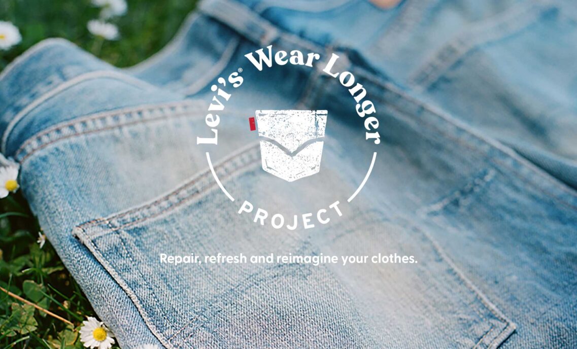 a photo of the back pockets of a pair of denim jeans lying on grass overlaid with a graphic logo reading "Levi's® wear longer project" above the text "repair, refresh and reimagine your clothes"