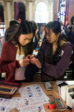 Two San Francisco high school students attend a repair workshop as part of the Levi's® Wear Longer Project