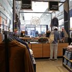 A Levi's® consumer stands at the Levi's® Tailor Shop inside a Levi's® retail location