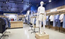 The interior of a Levi's® retail store featuring a mannequin display and clothing racks