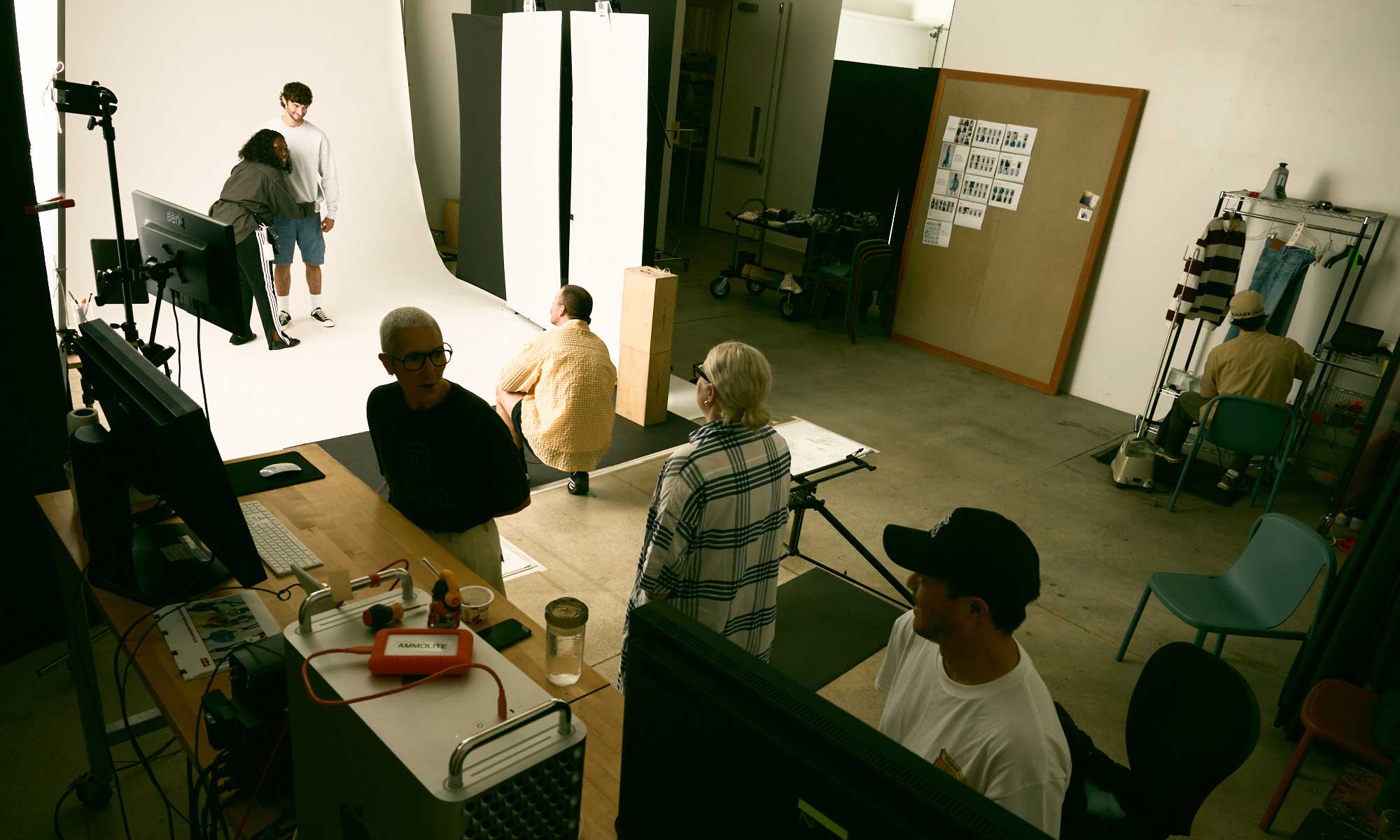 Members of the Levi's® Global Brand Creative Photo Studio team style a model in the photography studio room