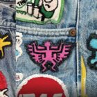 Three vertical side-by-side photos of patches on a pair of Levi's® 501® jeans that belonged to artist Keith Haring