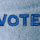 "Vote" spelled out with denim jeans graphics against a denim texture background